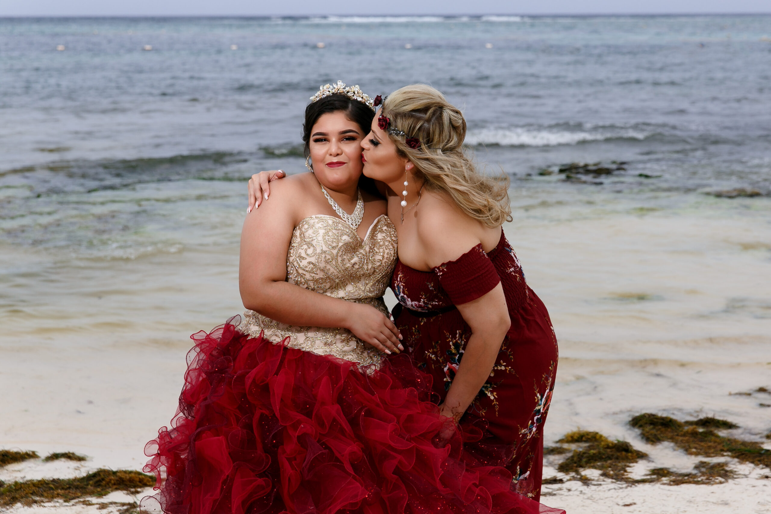 Mama kisses her baby girl at her Quinceanero on the Akumal beach