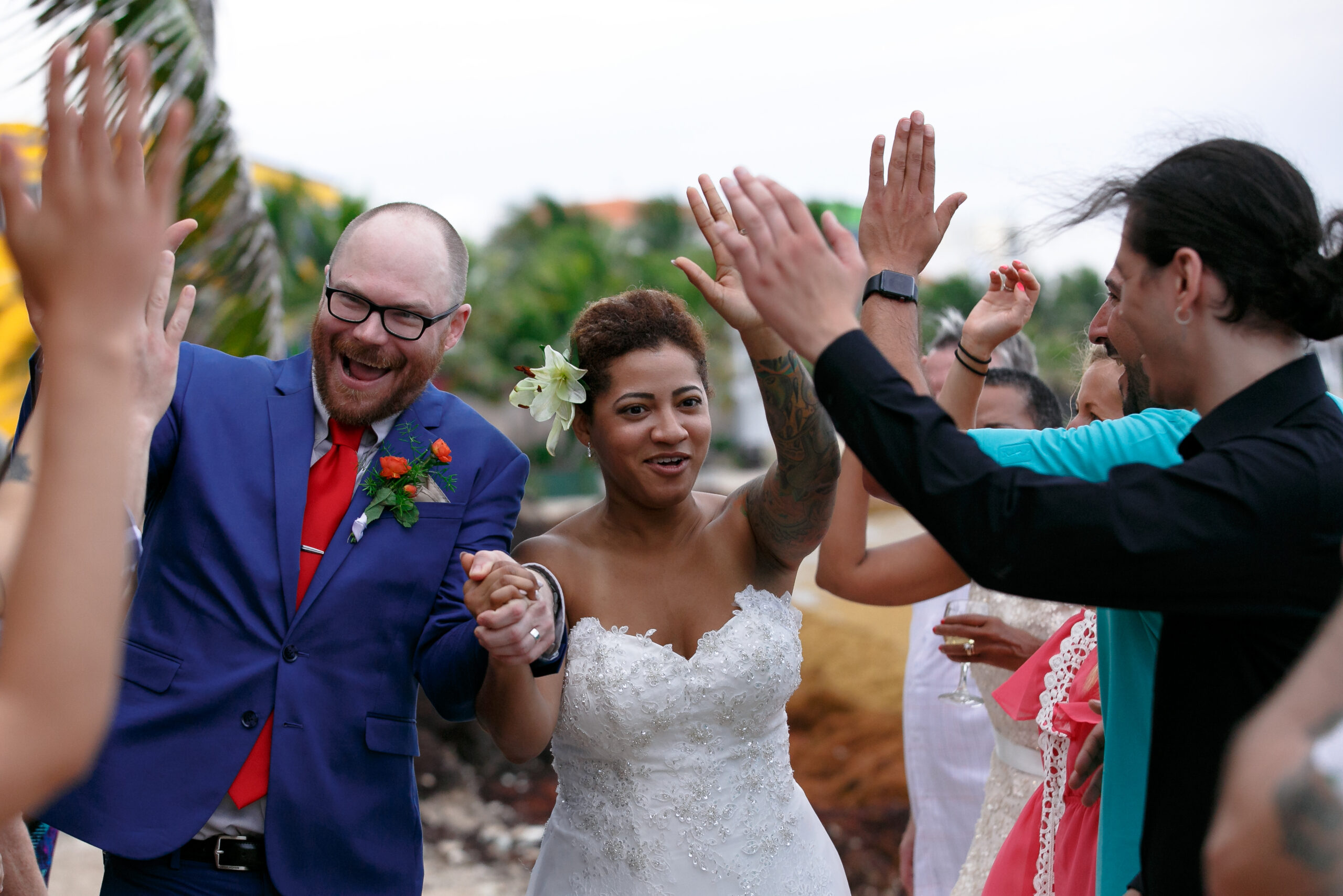 Newlyweds walk gauntlet of high fives from guests