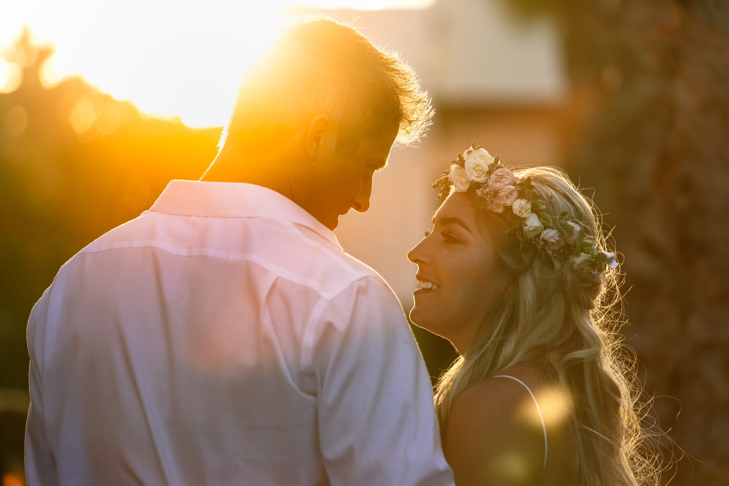 Sunset silhouette of newlyweds at their Dreams Riviera Cancun wedding