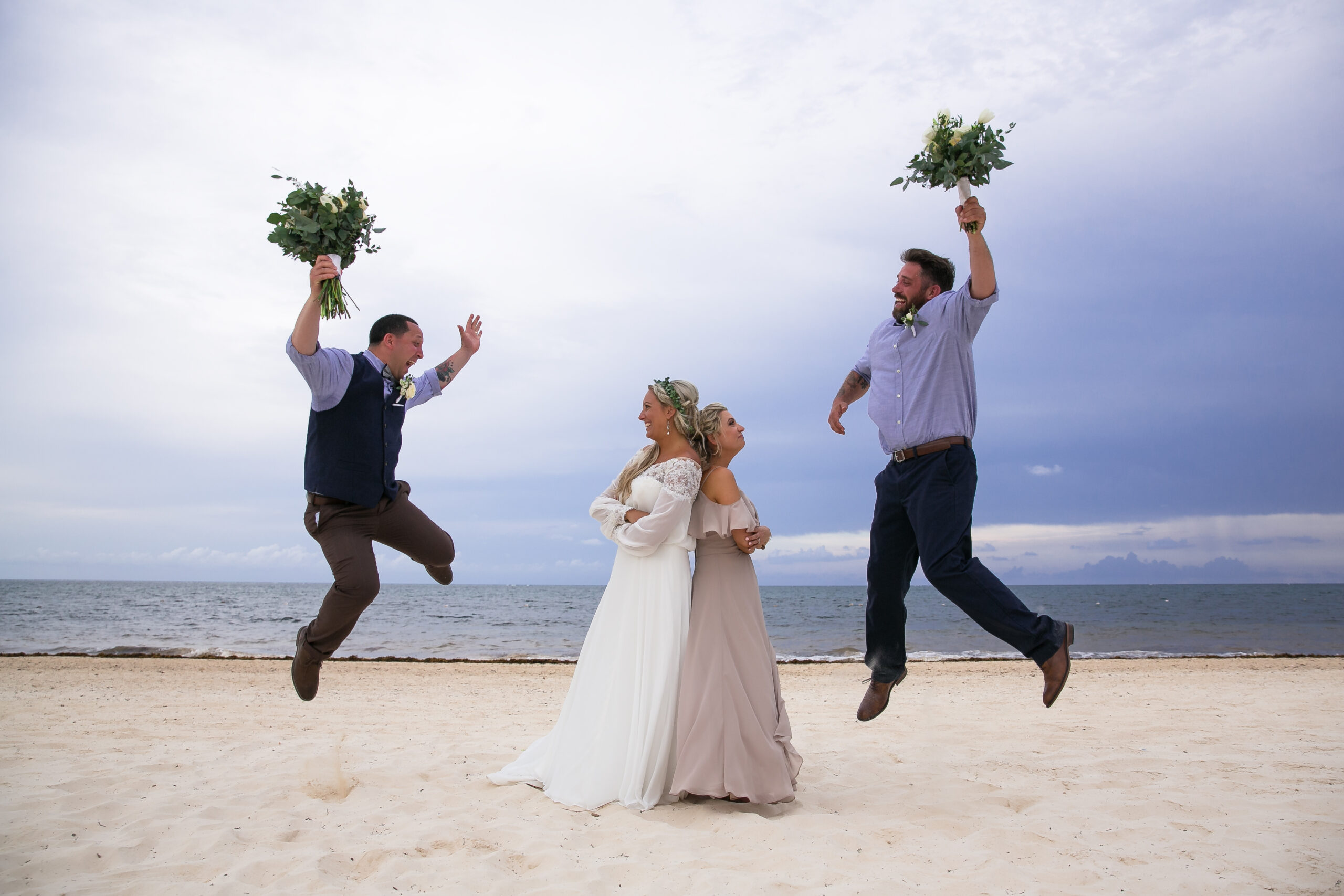 Wedding party clowning on beach of Dreams Riviera Cancun Wedding