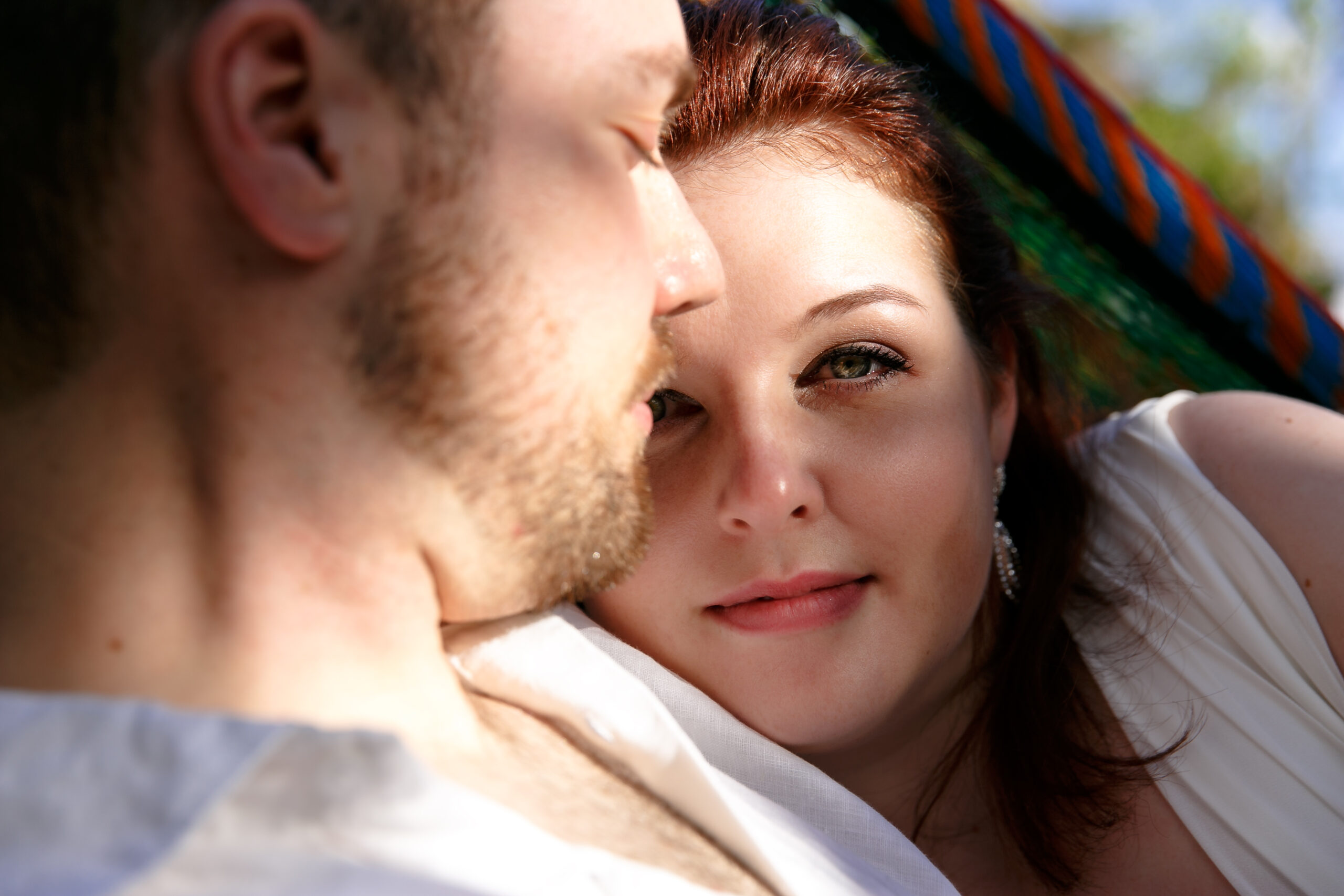 Newly engaged couple snuggle at Iberostar session