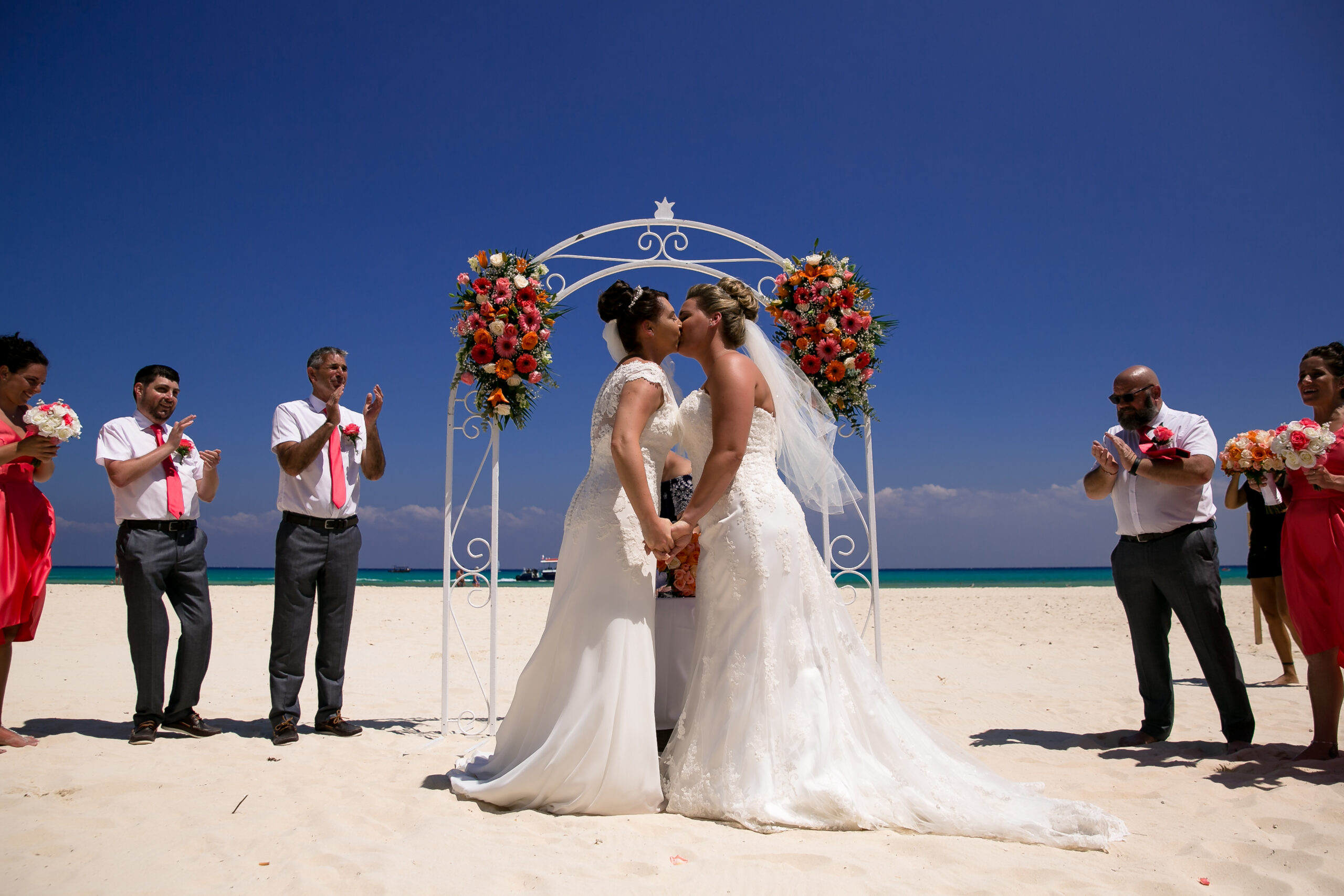 Newlywed's first kiss at their same-sex Riu Yucatan wedding