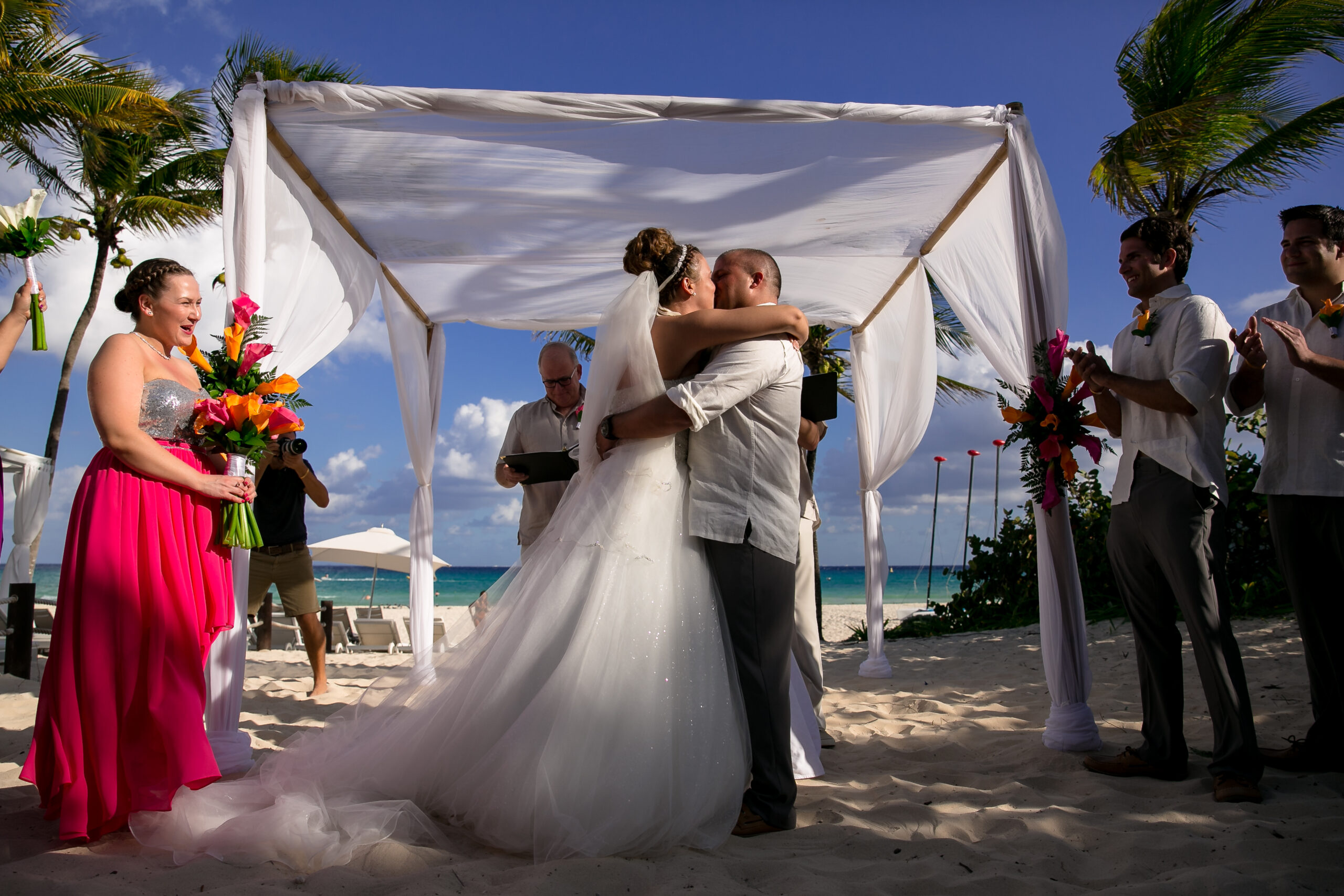 Just married couple embrace at their Riu Yucatan beach wedding