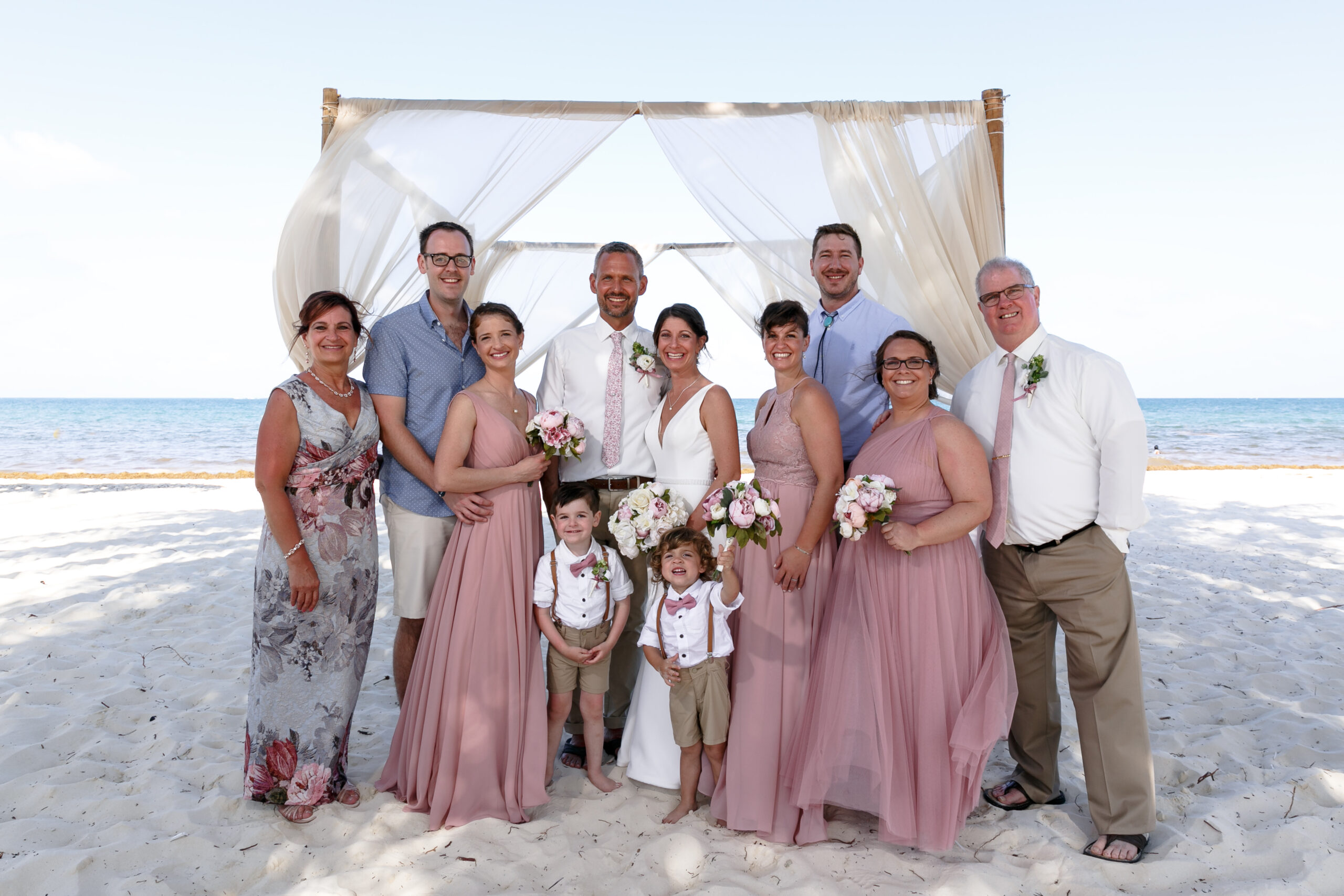 Newlyweds pose with happy family on Royalton beach