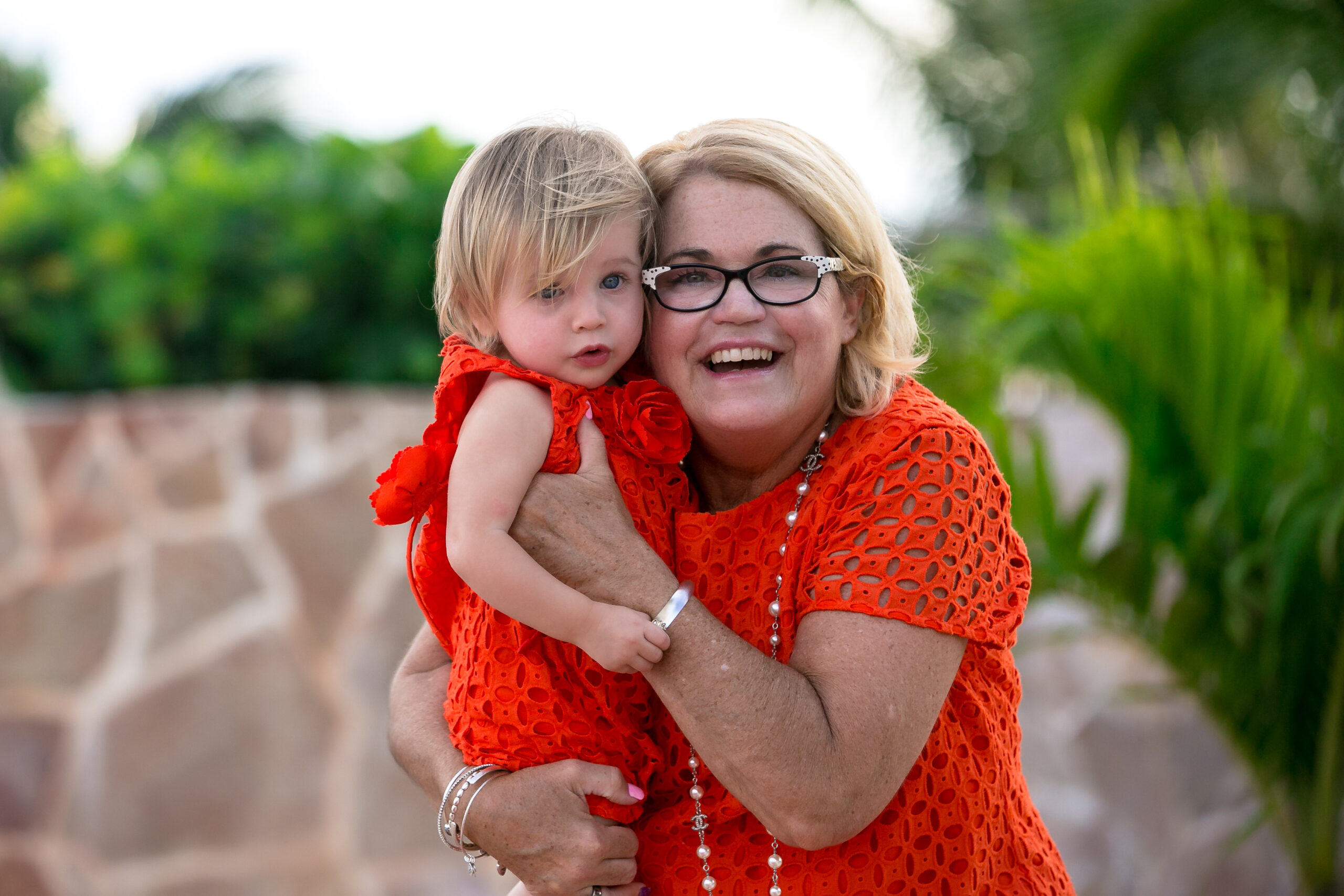 Granny snuggles granddaughter at Villa del Mar Azul Beach