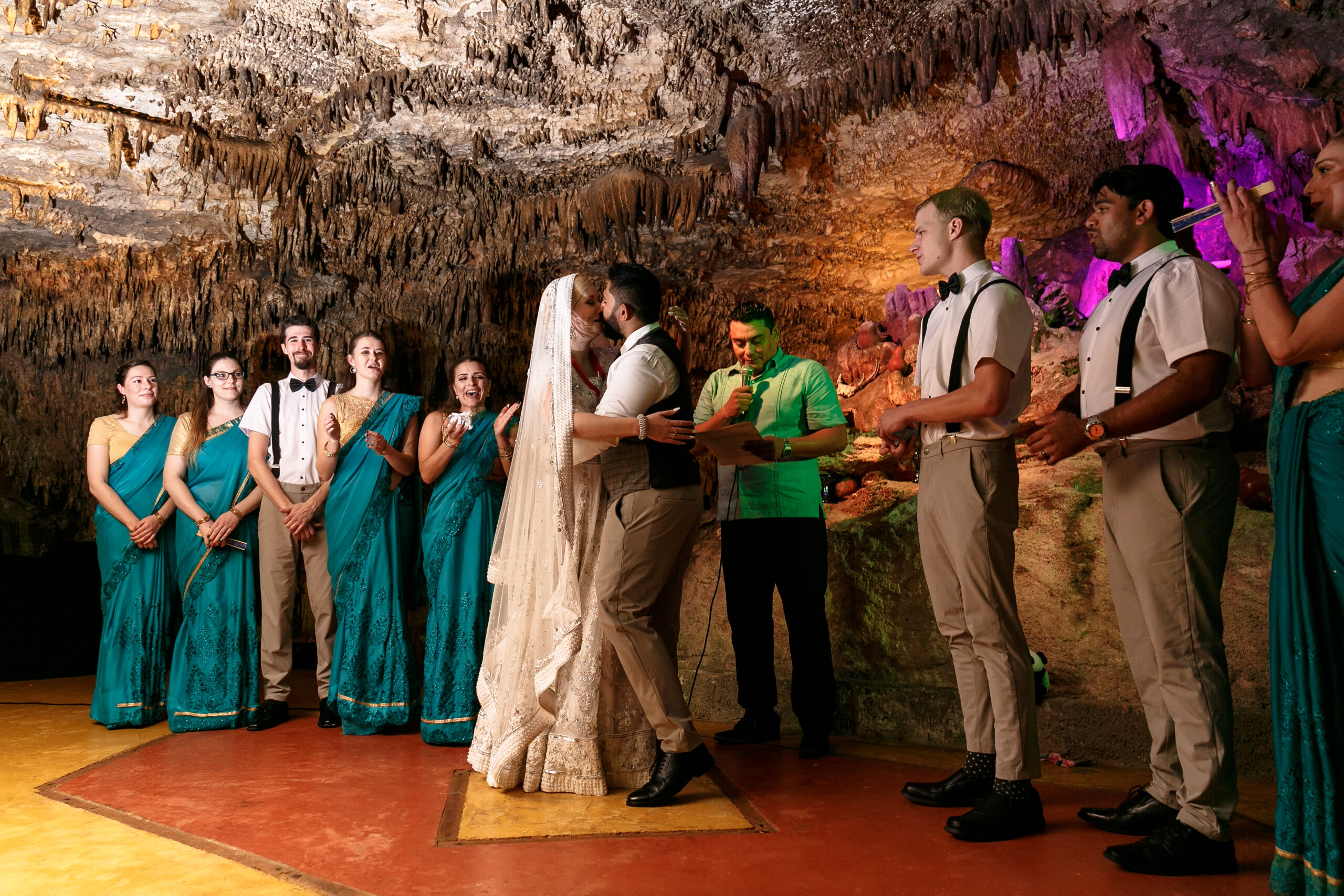 Bride + Groom kiss at their Alux Hindu Wedding