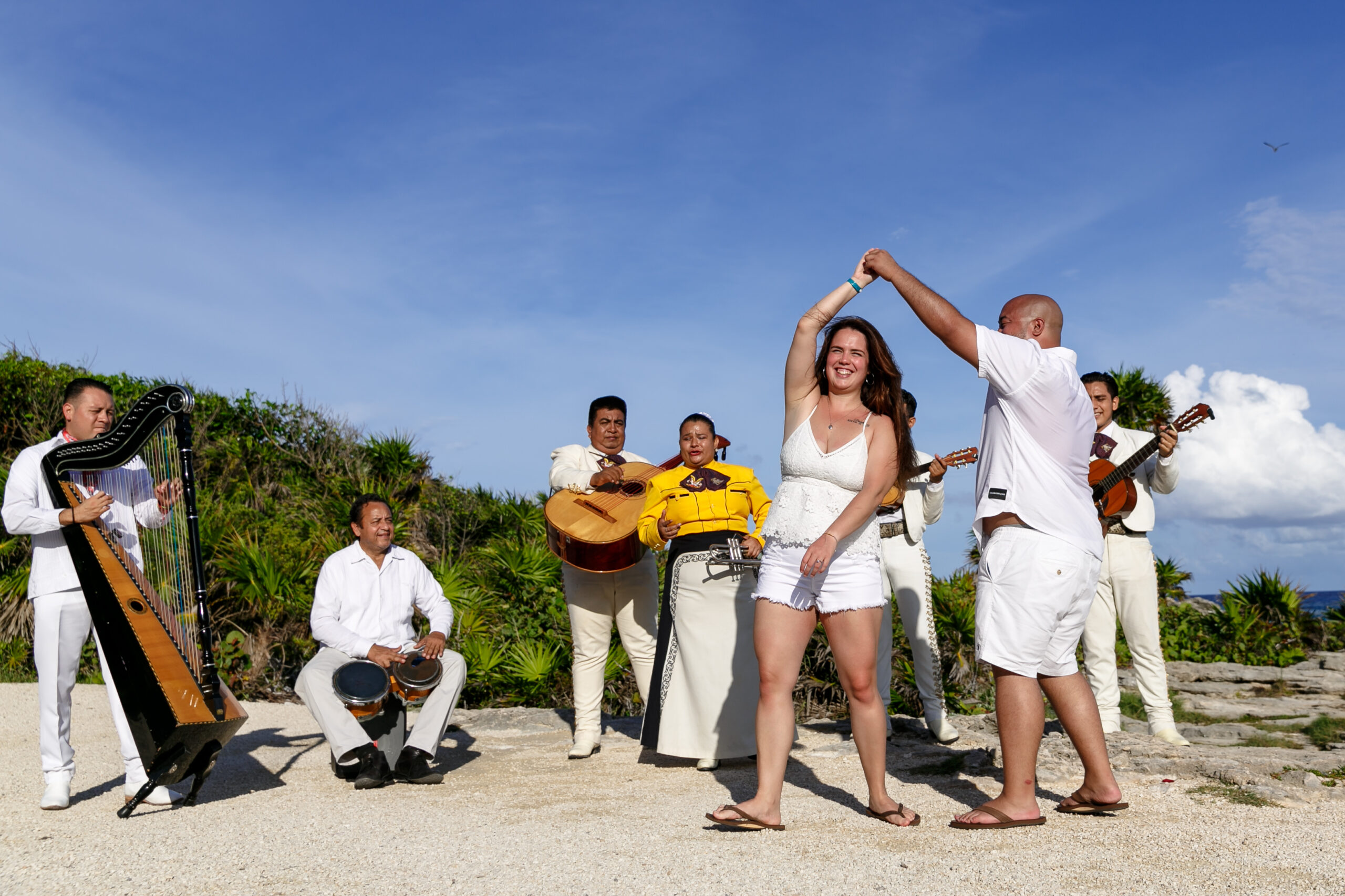 Newly engaged couple dances for joy, serenaded by mariachis