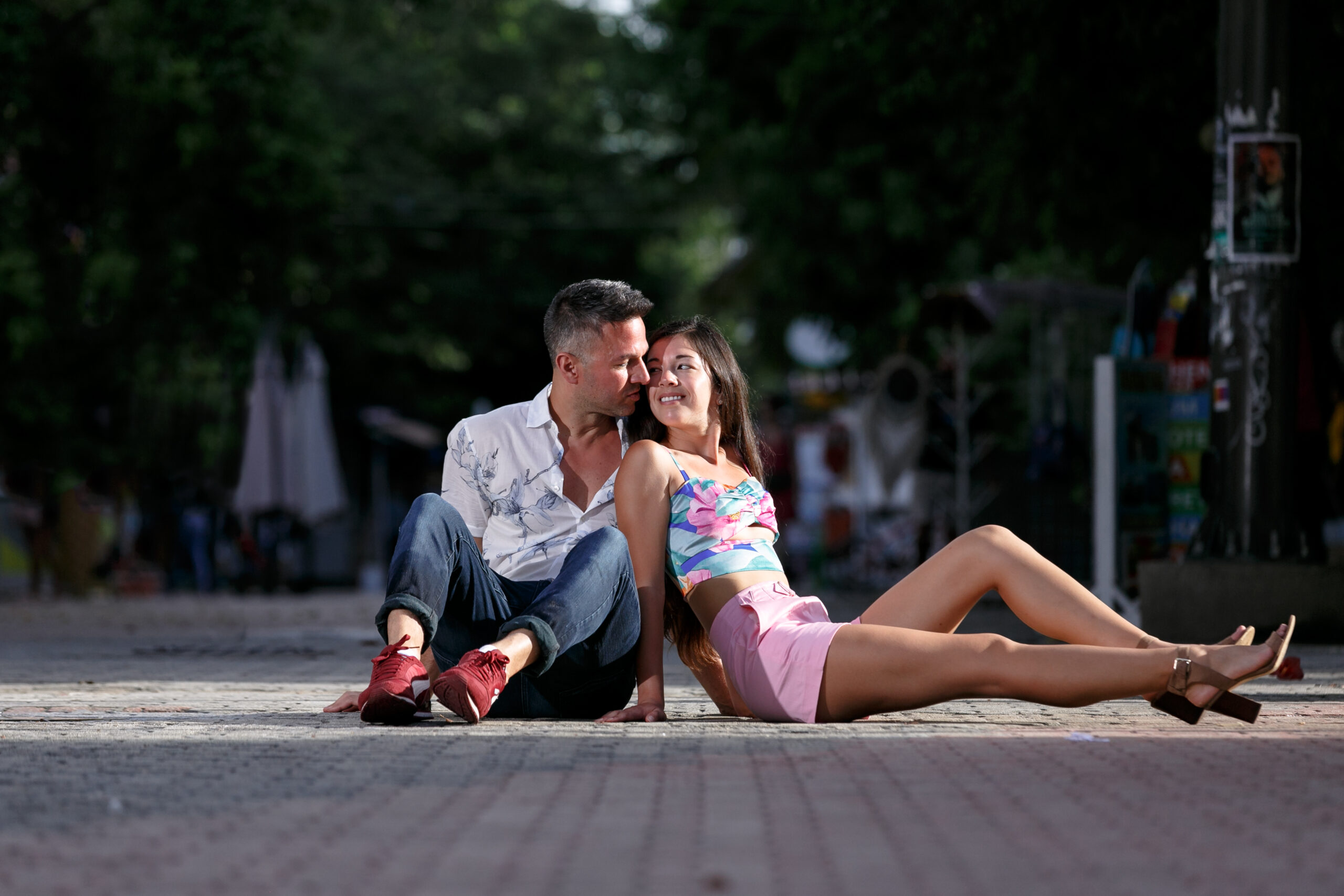 Engaged couple lounge on Playa del Carmen street