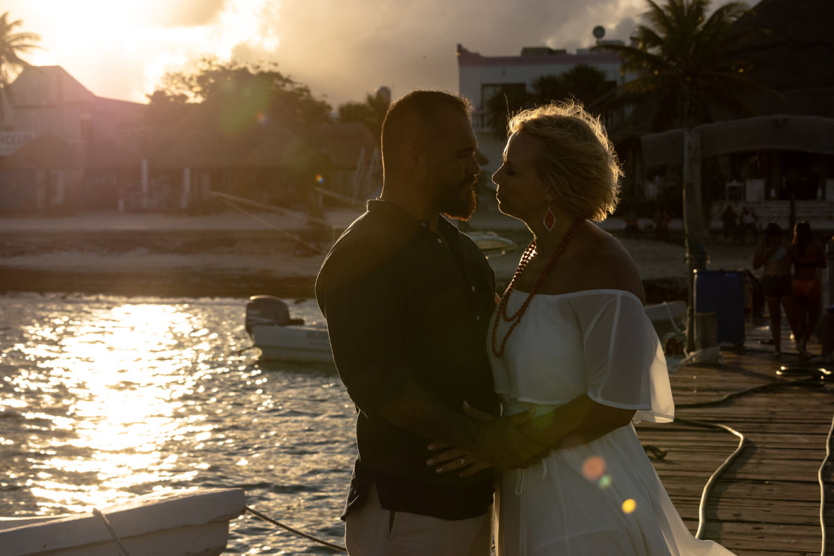 Couple silhouette in front of dramatic sunset