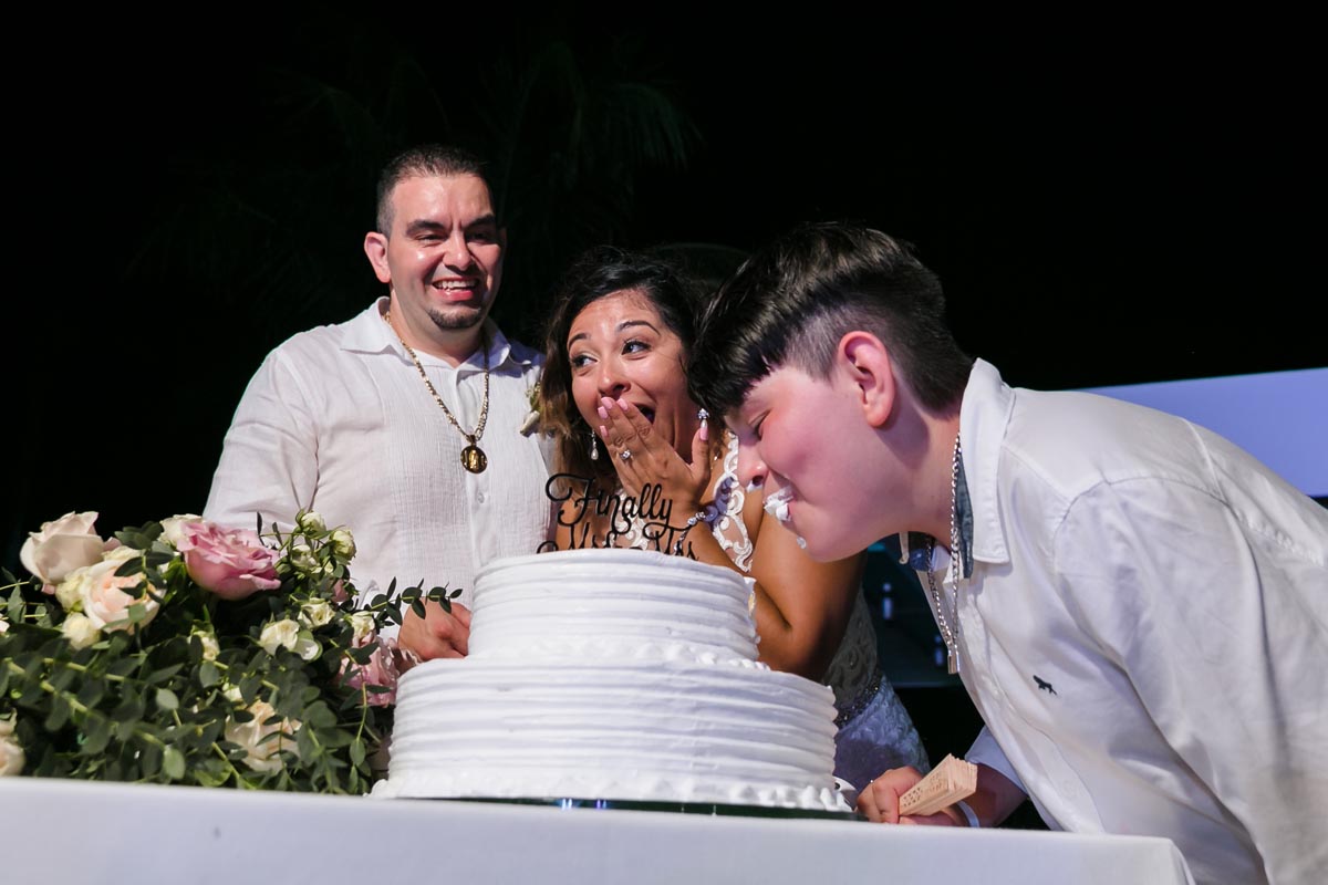 Son bites wedding cake in front of his newlywed parents