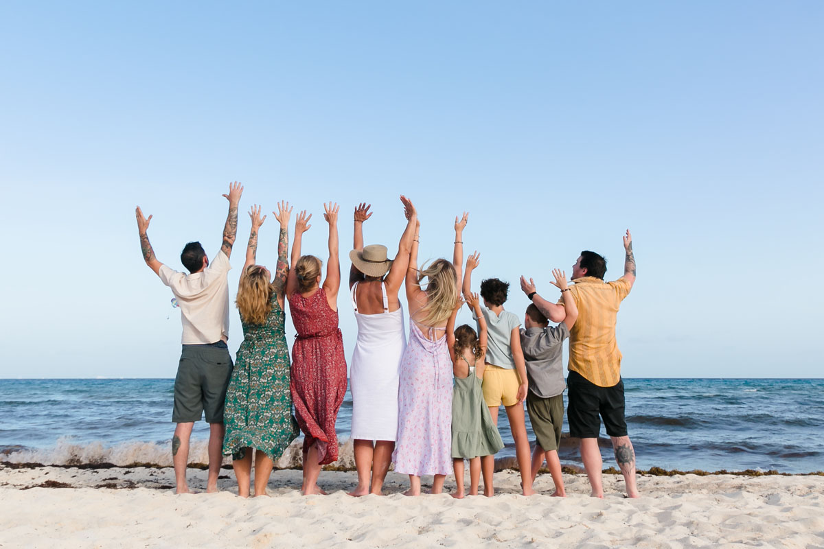 Family cheer looking out over the ocean together