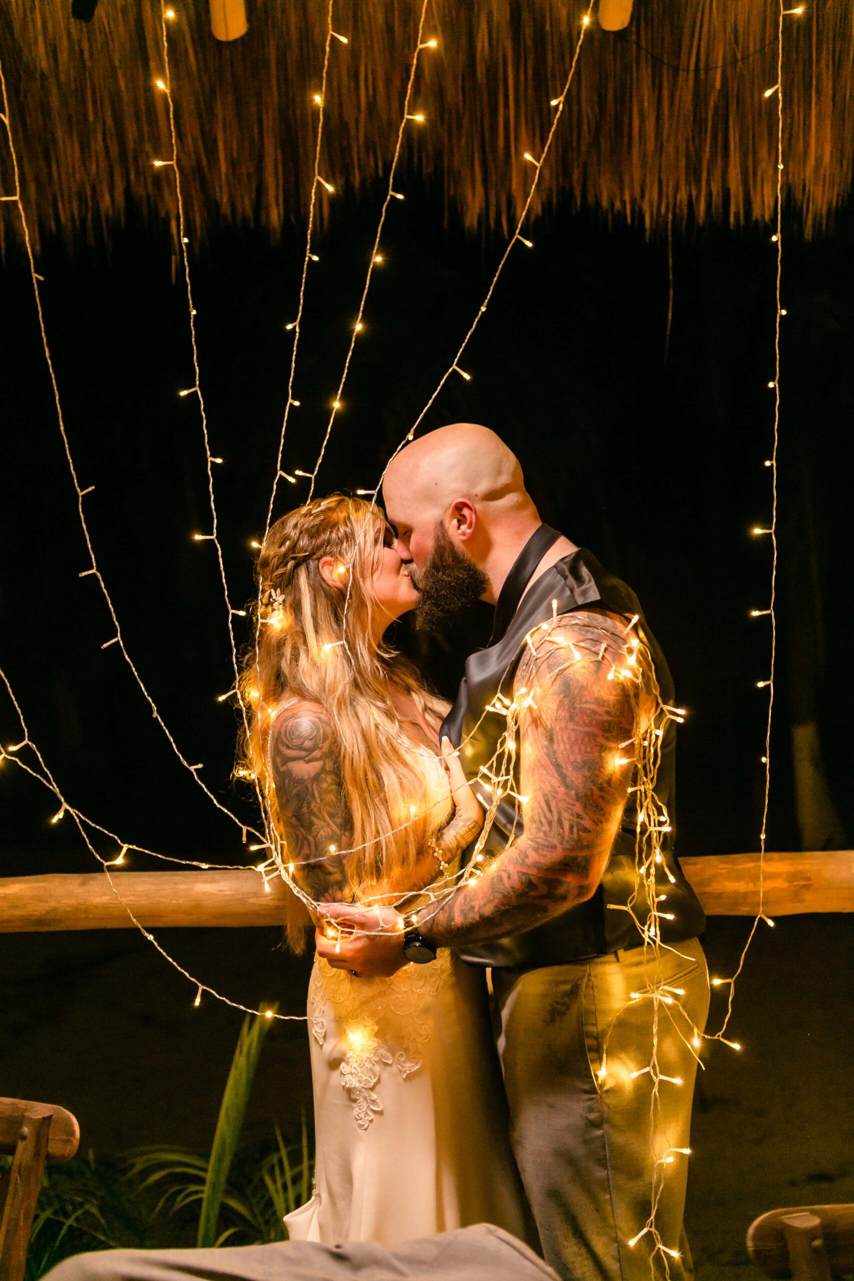 Newlyweds kiss at their reception