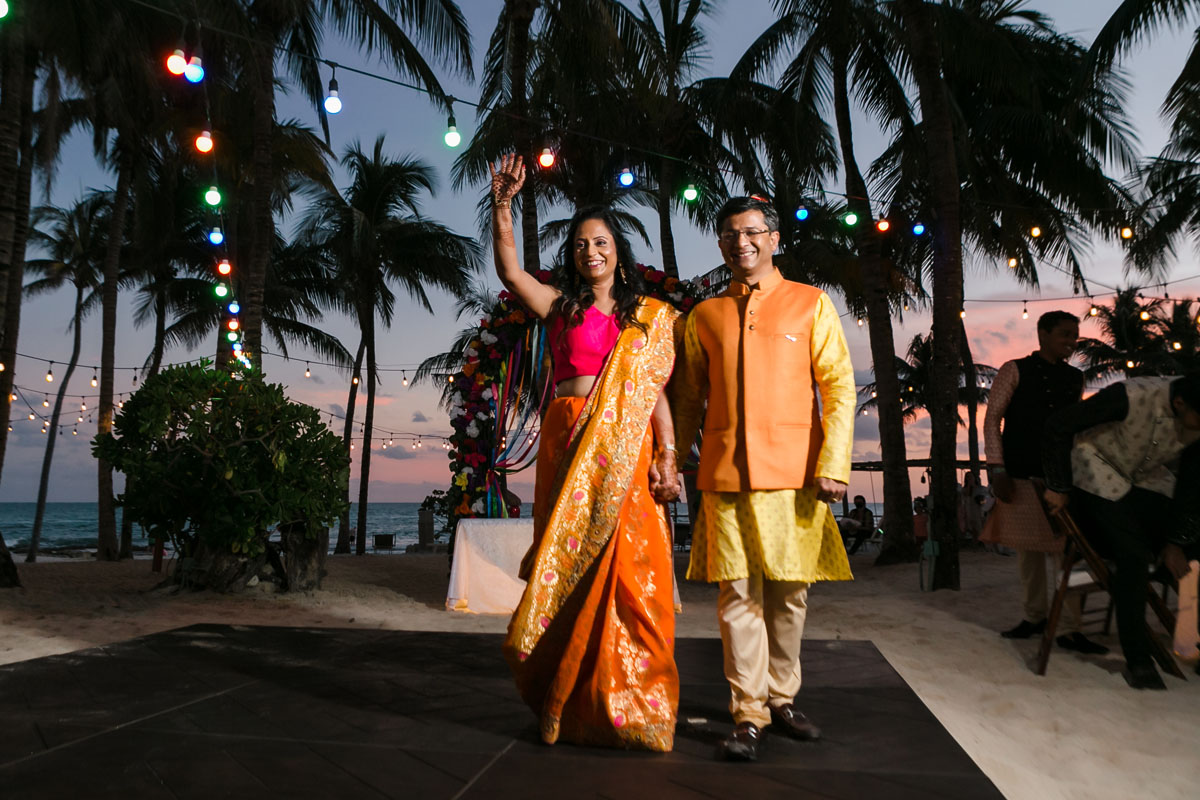 Hindu couple cheer entering the reception