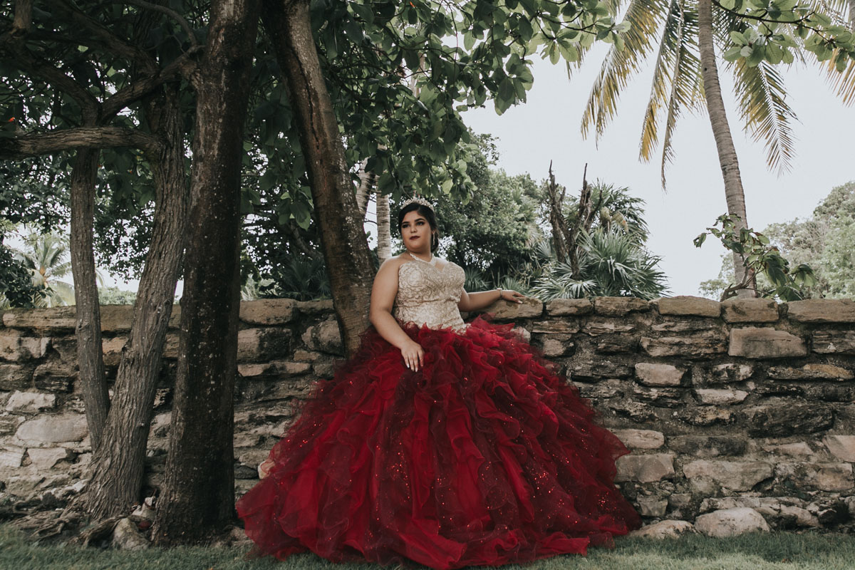 AkumalQuinceaneraLisiLeansOnRockWall