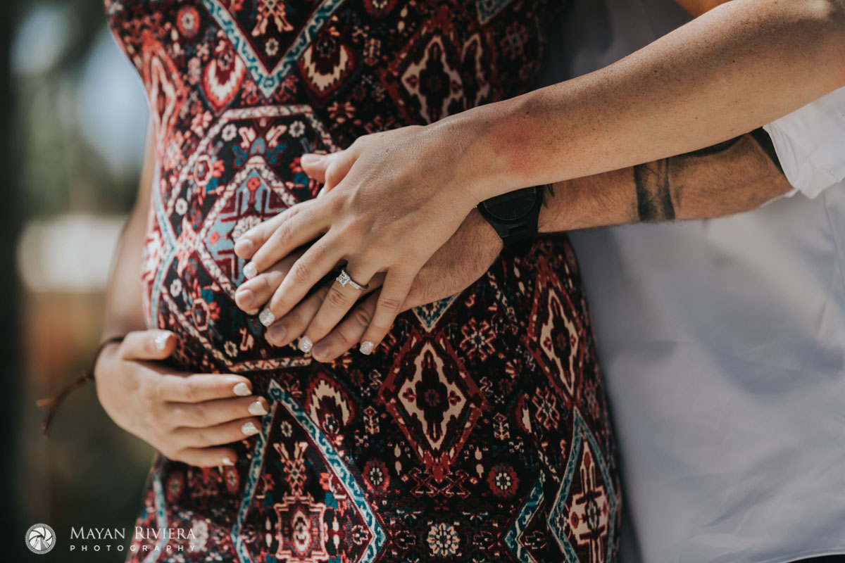 ExpectantDadCradlesBabyBump