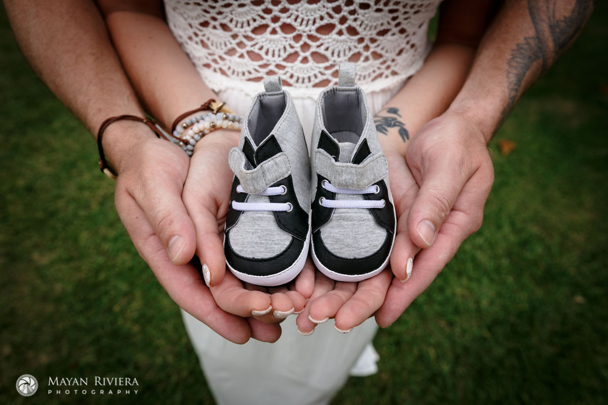 ExpectantParentsHoldBabyShoes