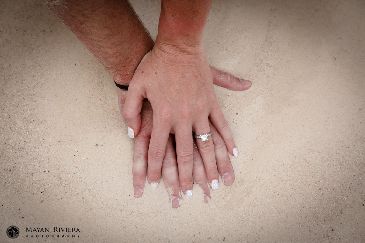 ExpectantParentsInterlaceSandyFingers