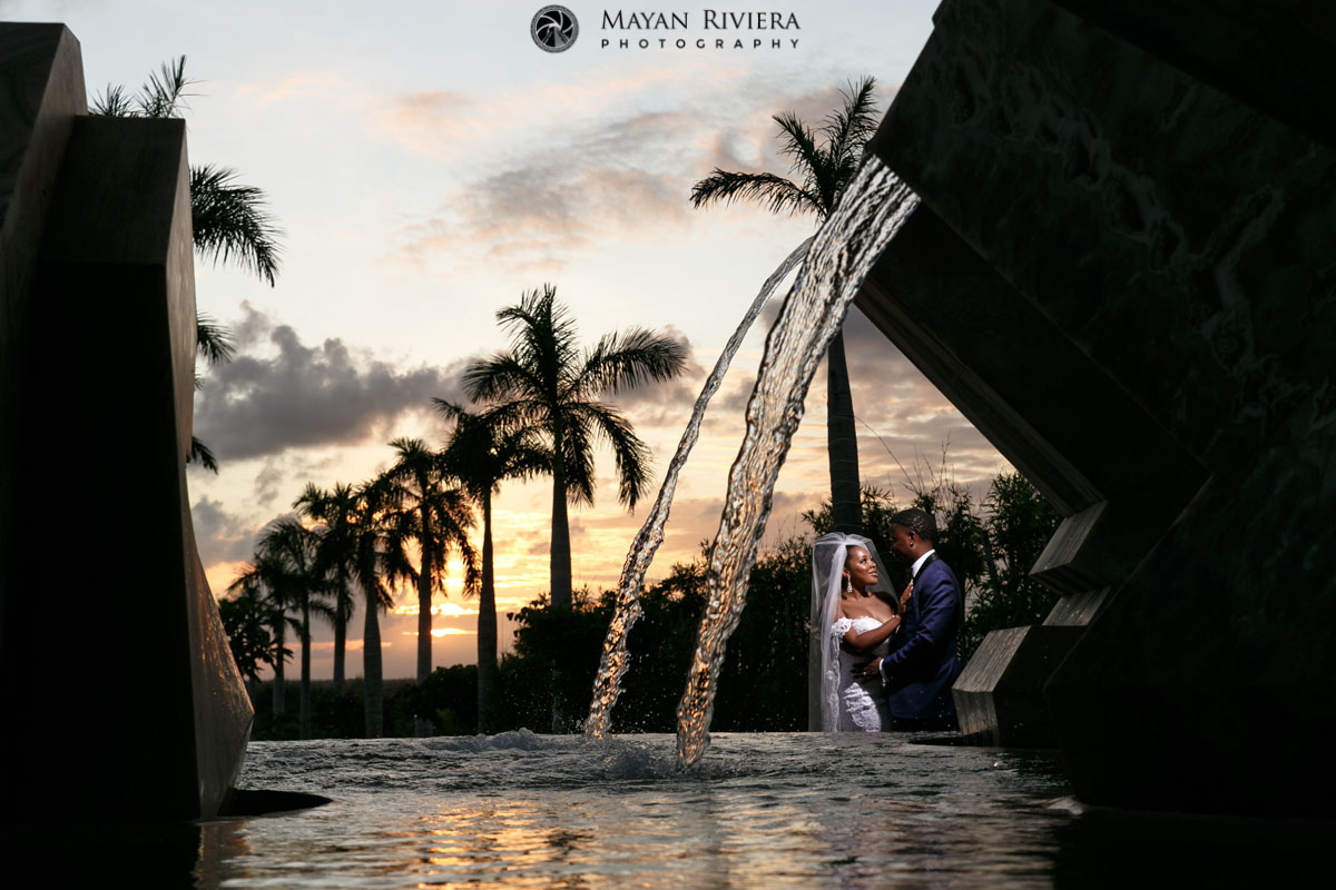 NewlywedsPoseBySunsetWaterFall