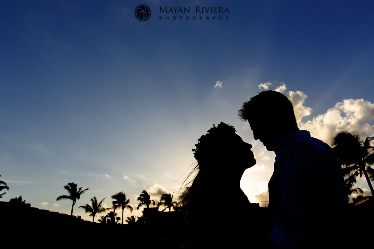NewlywedsShilouettedBySunset