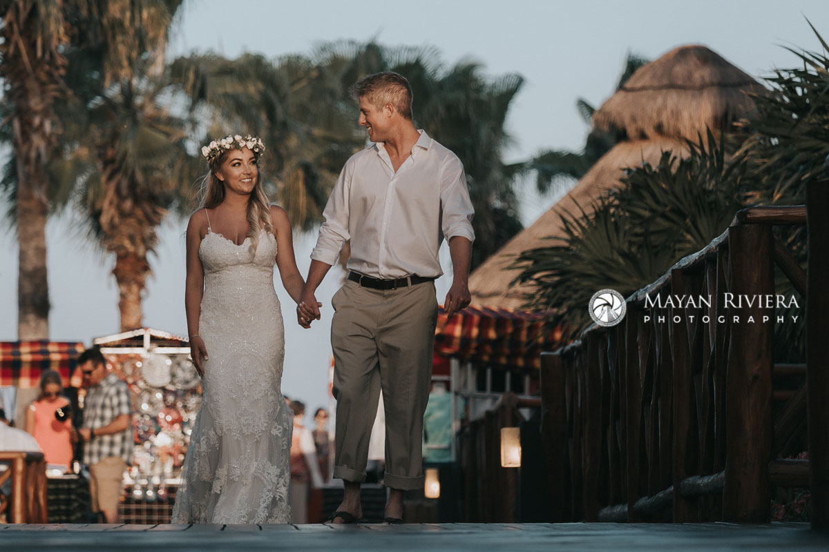NewlywedsHoldingHandsWalking