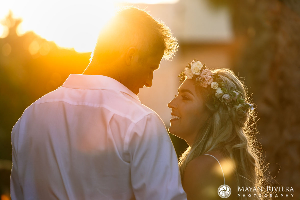 NewlywedsShilouettedBySunset