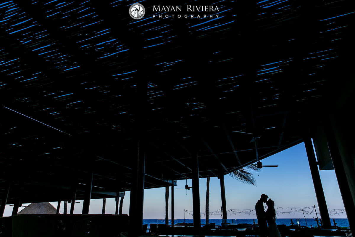 NewlywedsShilouettedBySunset