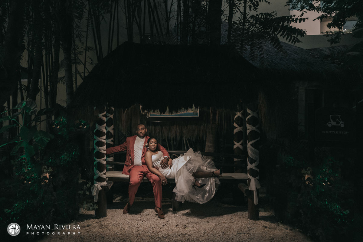 NewlywedsReclineOnBeachBench