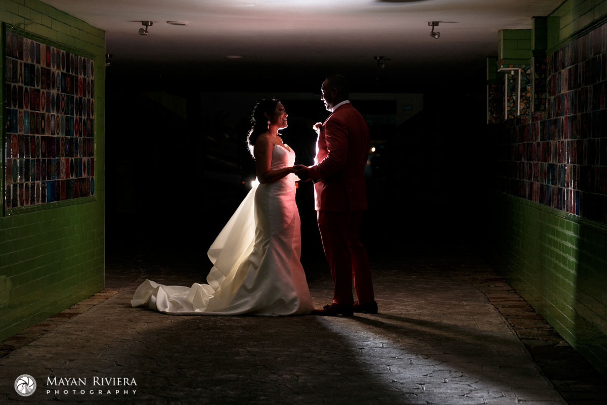 NewlywedsPoseByMosaicWalls