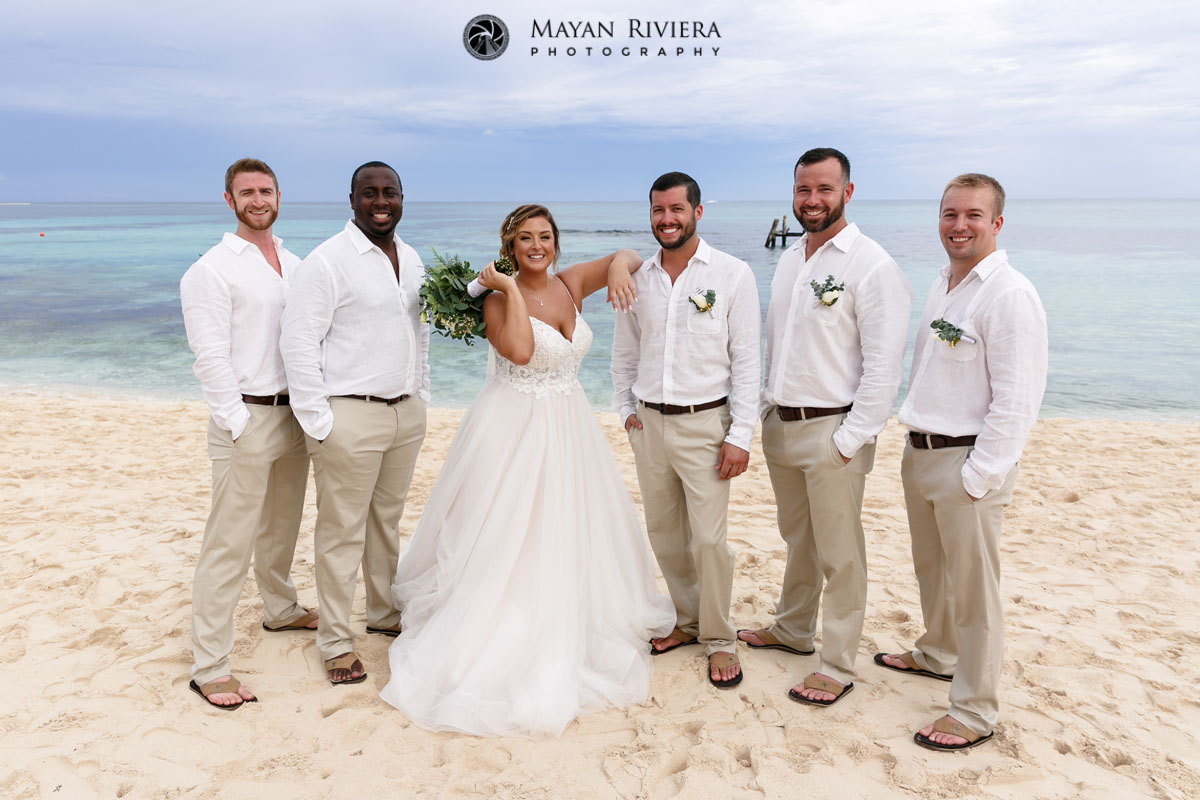 GroomsmenWithBrideOnBeach