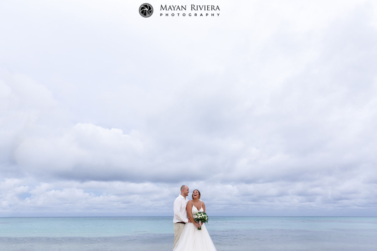 CheeringBrideAndGroomOnBeach