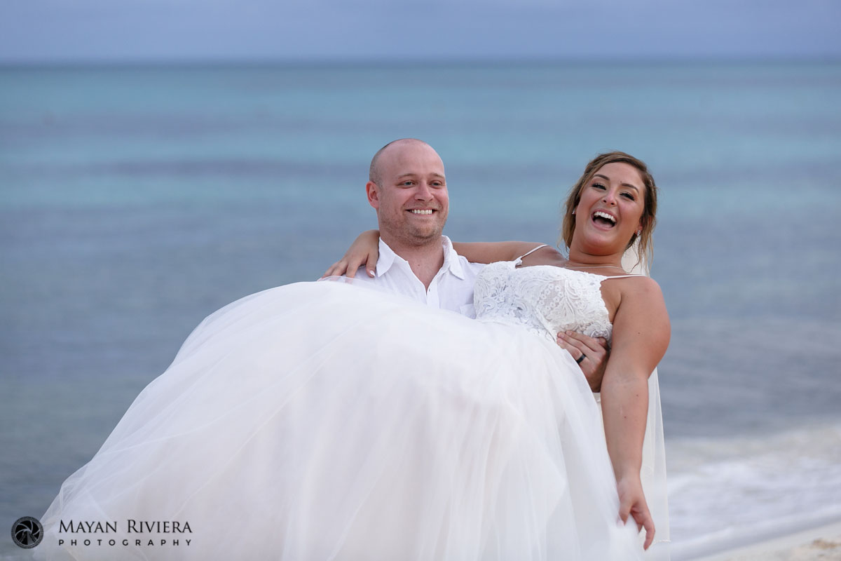 GroomHoldsLaughingBride