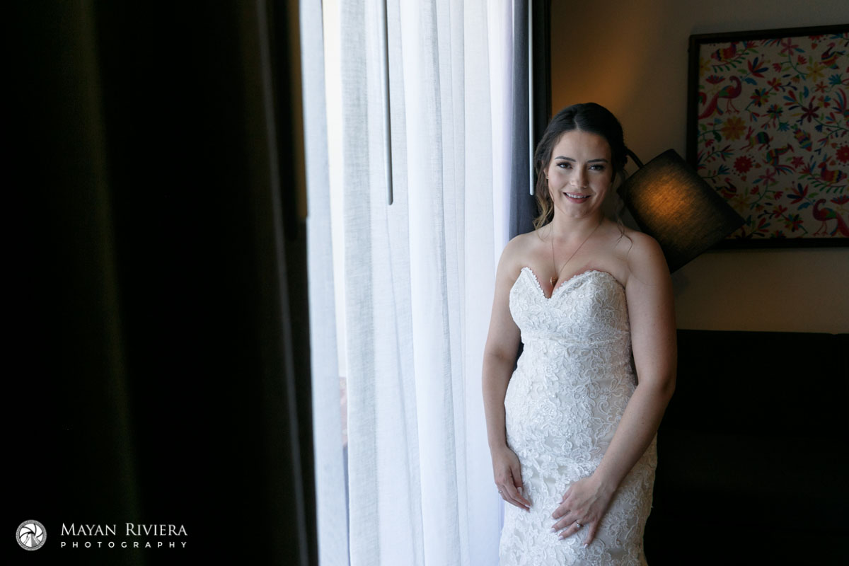 SmilingBrideStandsByWindow