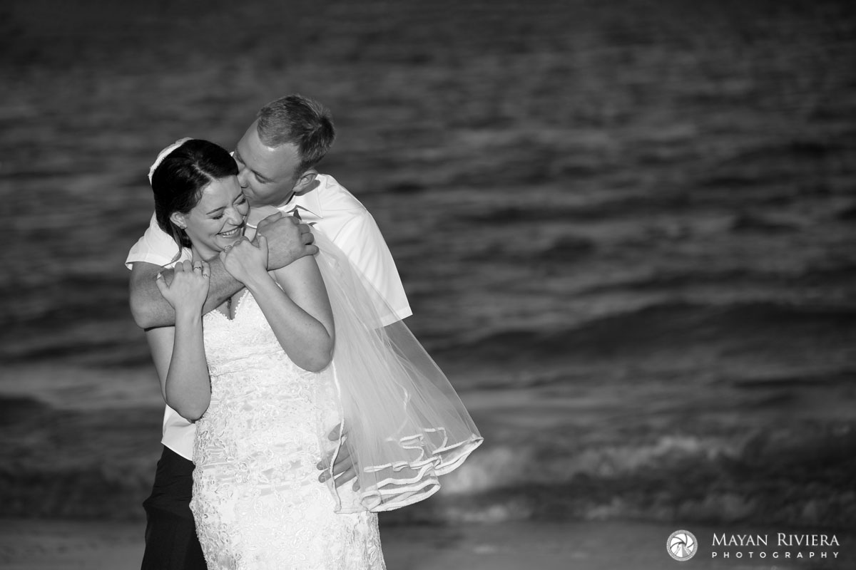 NewlywedsKissOnBeach