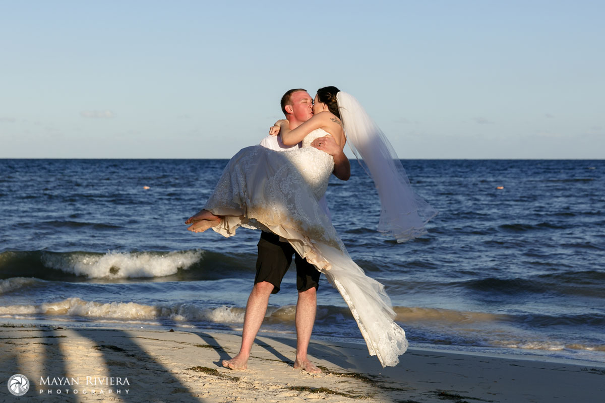 NewlywedsKissOnBeachTwirling