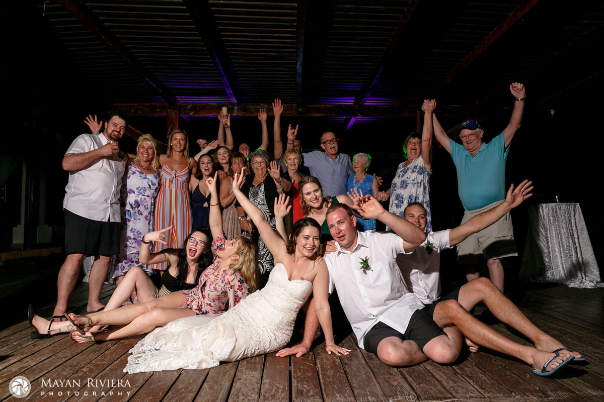 NewlywedsCheerWithWeddingGuests