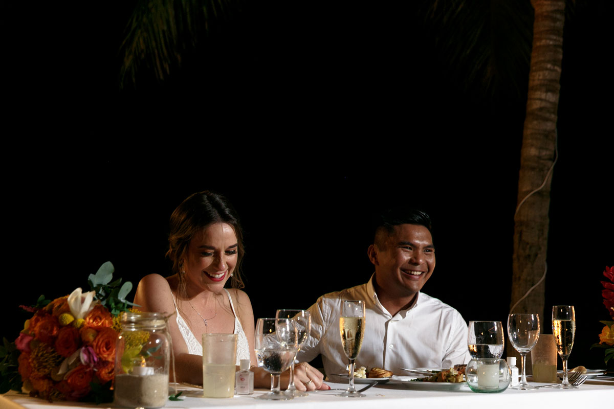 LaughingNewlywedsAtHeadTable