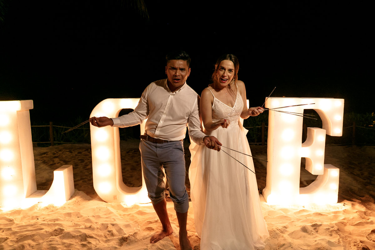 NewlywedsHoldSparklerStix