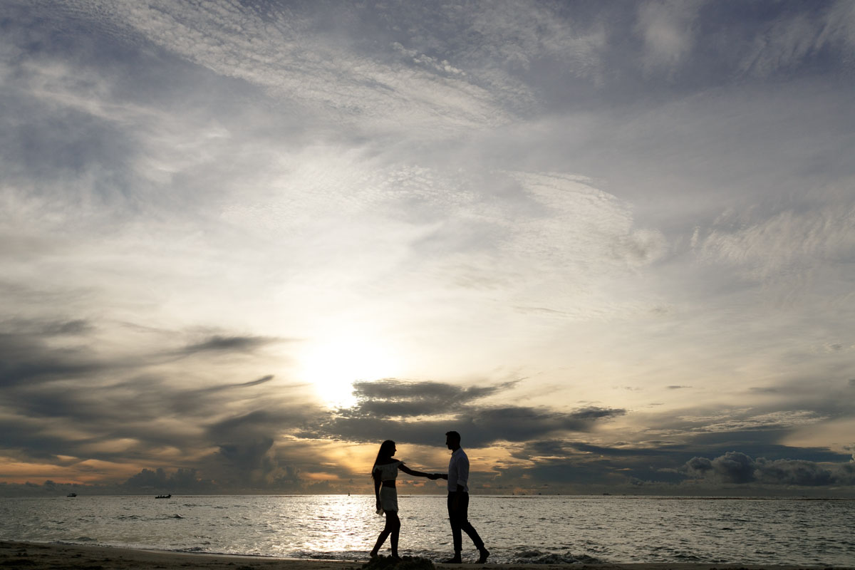 NewlyEngagedCoupleDanceOnPdCBeachAtSunrise