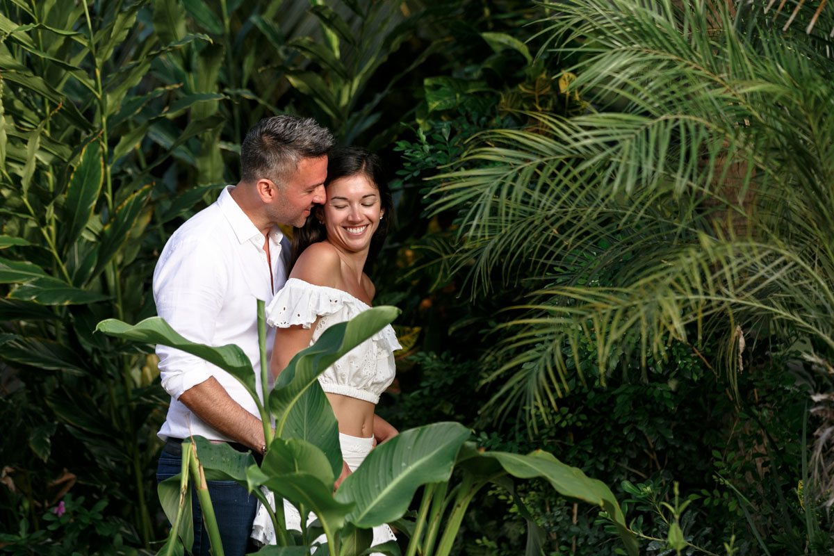 NewlyEngagedCoupleSnuggleInJungle