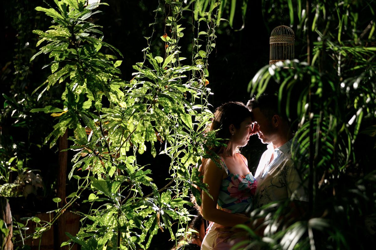NewlyEngagedCoupleSnuggleInJungle