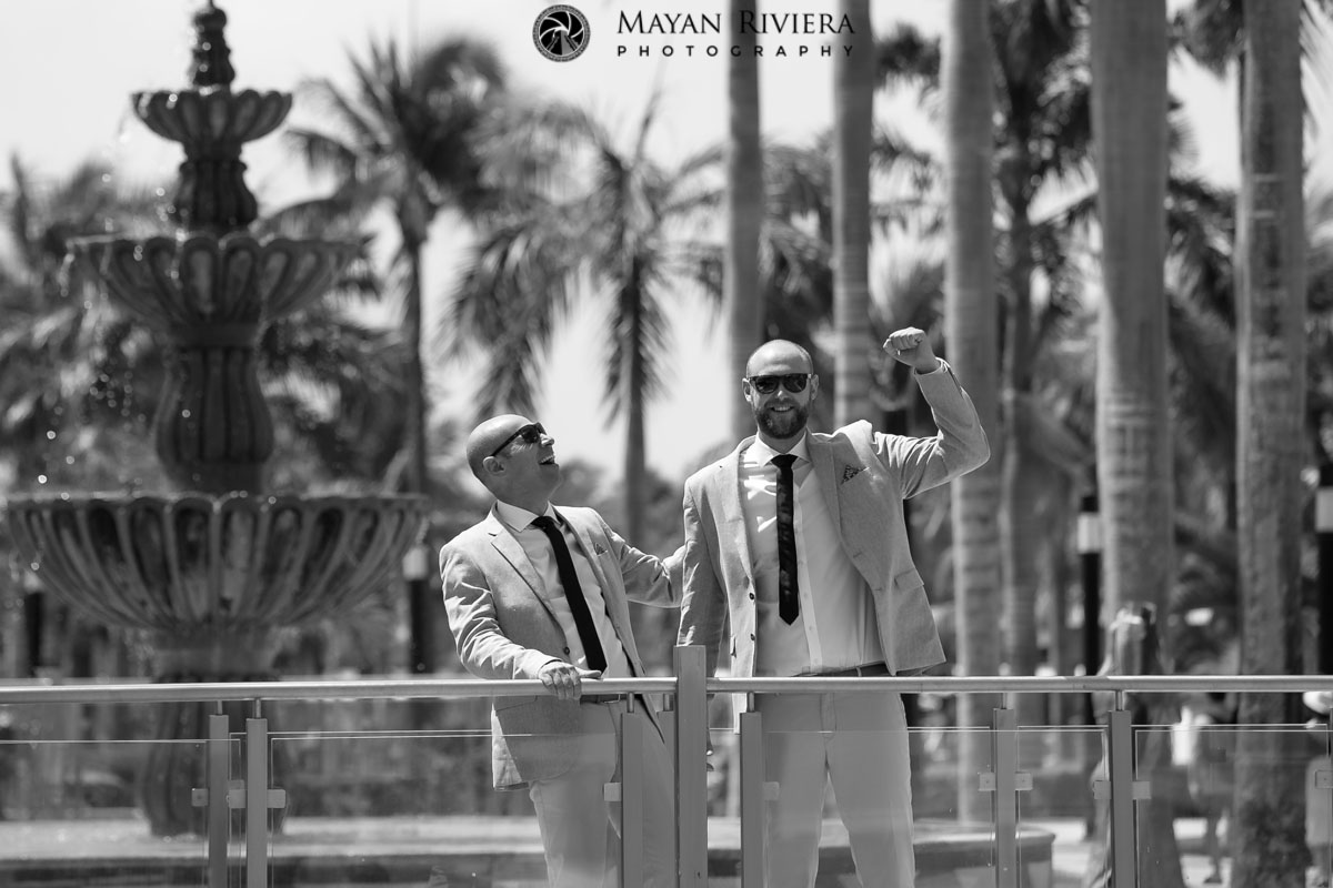 GroomAndGroomsmanPoseByFountain