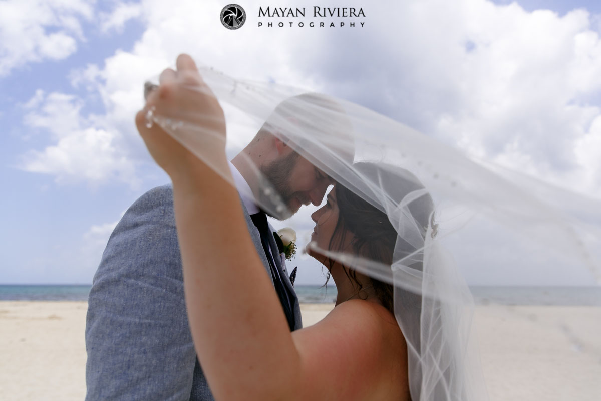 BrideAndGroomGazeAtEachOtherUnderVeil
