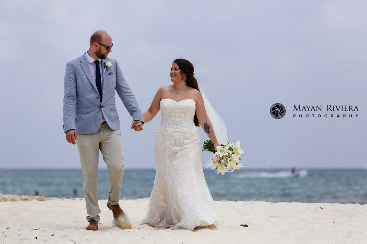 BrideAndGroomGazeAtEachOtherOnBeach