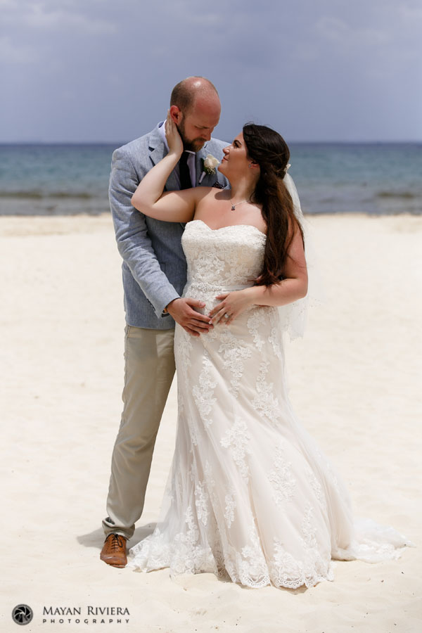 BrideAndGroomGazeAtEachOtherOnBeach