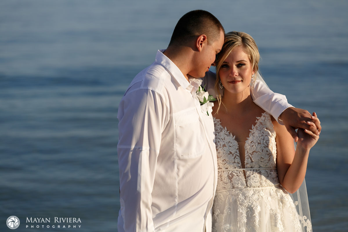NewlywedsSnuggleOnBeach
