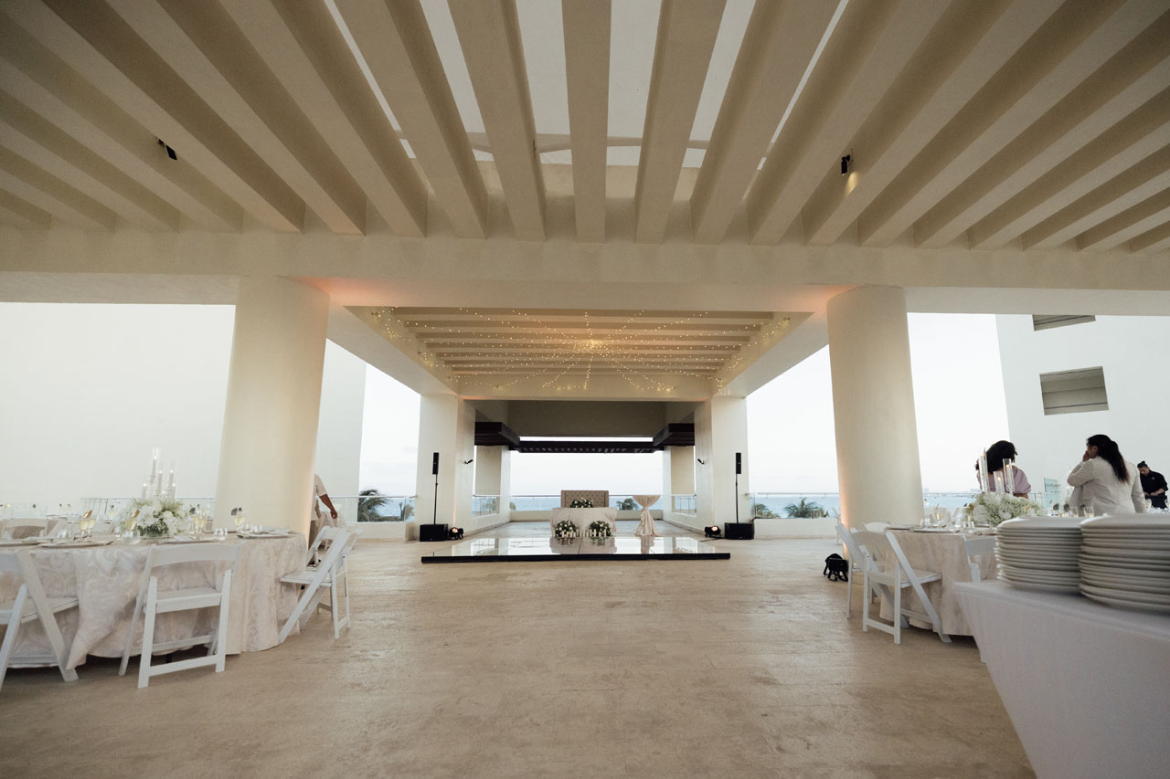 Minimal reception space with expansive slat ceiling and vast dance floor