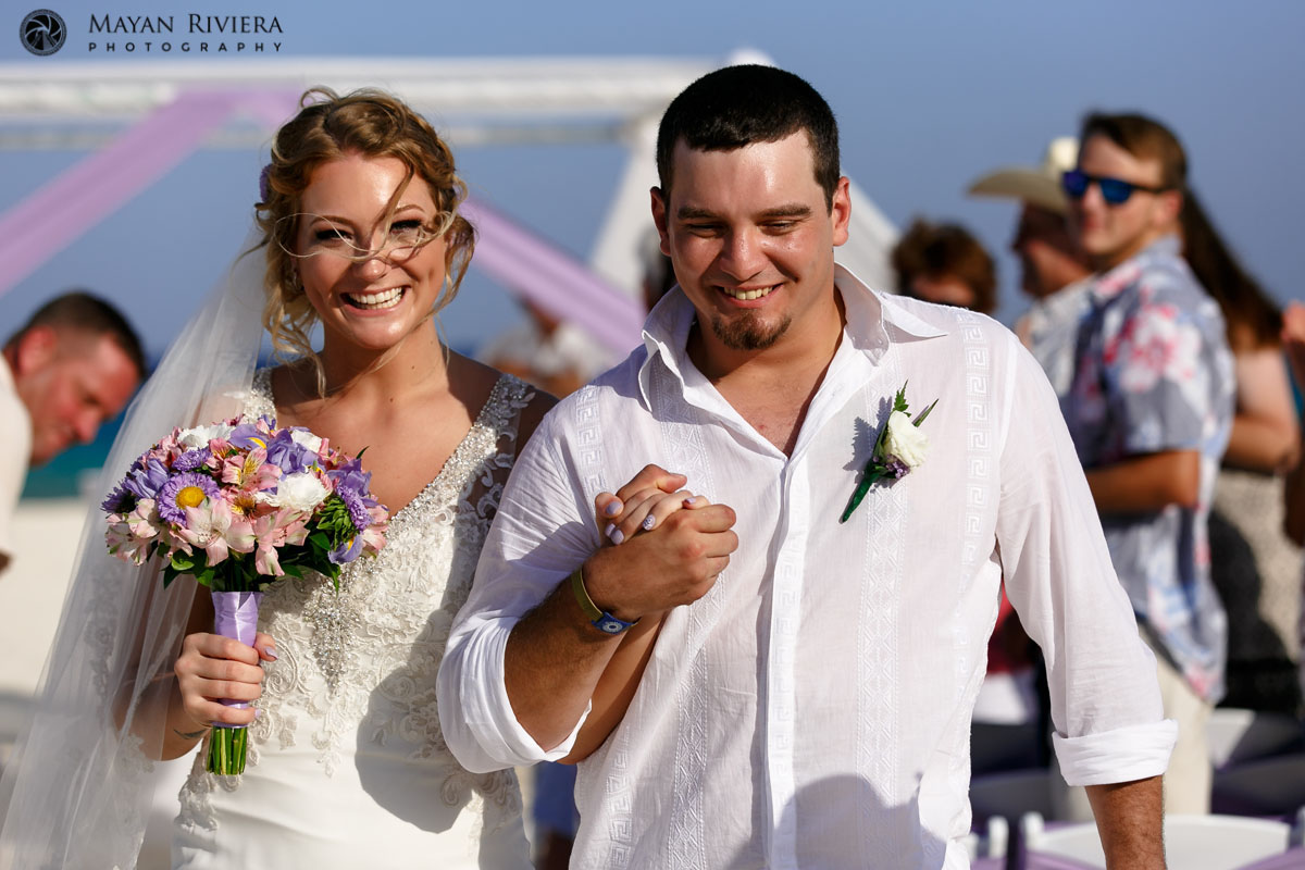 BeamingNewlywedsWalkingOut