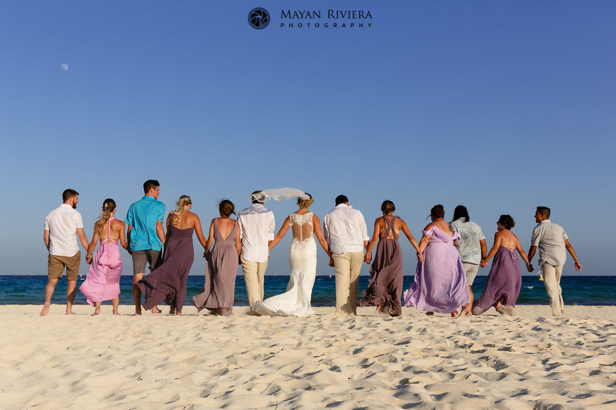 GuestsWalkWithNewlywedsOnBeach