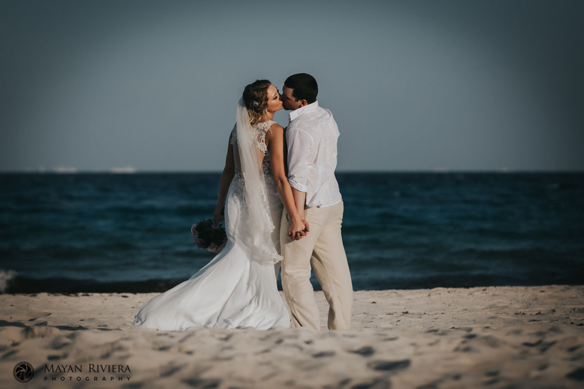 NewlywedsKissOnBeach