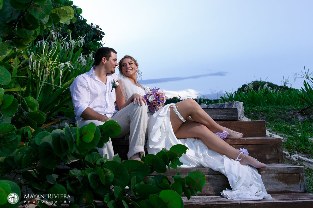 NewlywedsSittingOnBeachStairs